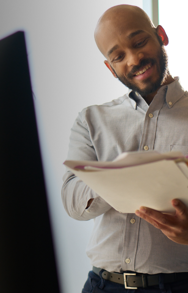 A man and woman reviewing documents together.