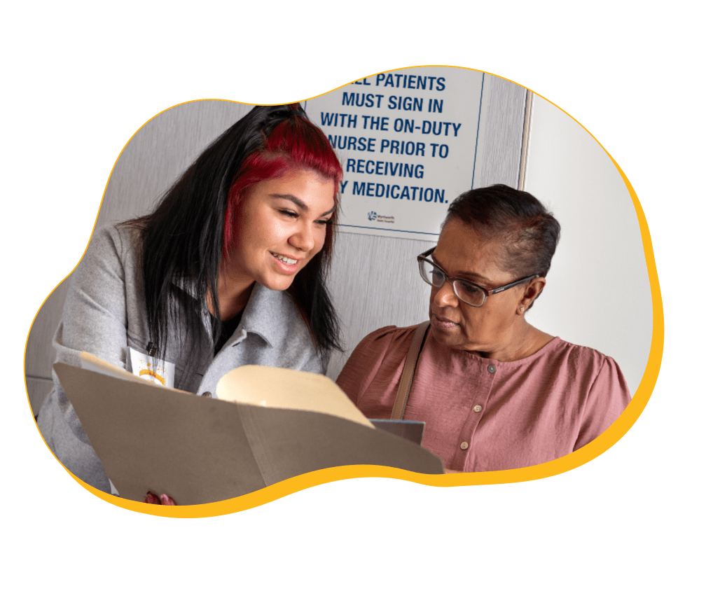 Two women discussing HIV treatment options.